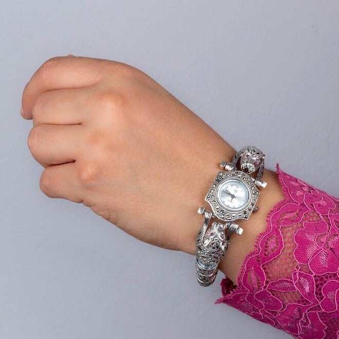 Women's 925 sterling silver watch with marcasite stone accented with glowing dragon details